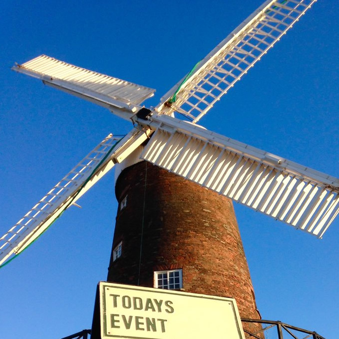 The windmill with a board outside saying 'Today's Events'