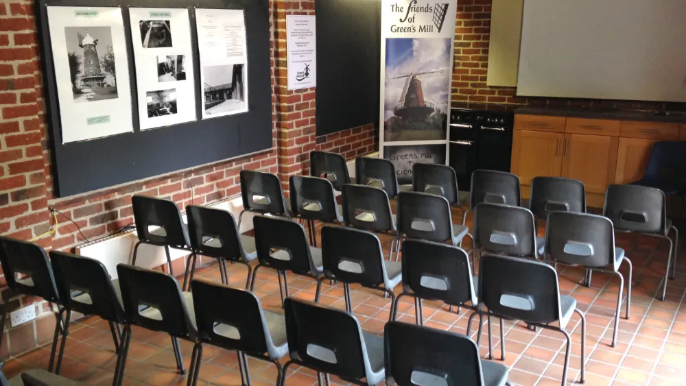 Activity space and room for hire at Green's Windmill. Rows of chairs in a room in front of a screen