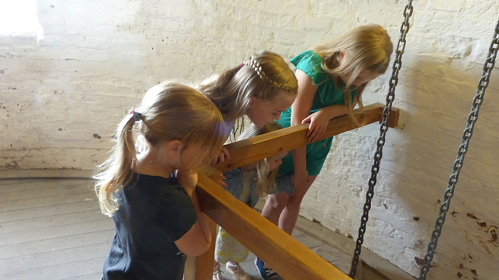 Children on a platform looking down inside Green's Windmill
